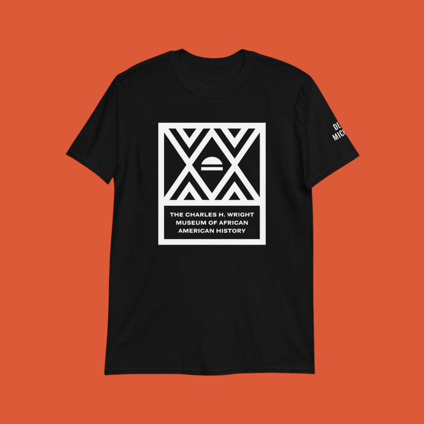 The logo of the Charles H. Wright Museum emblazoned , in white, on the front of a black, cotton t-shirt.