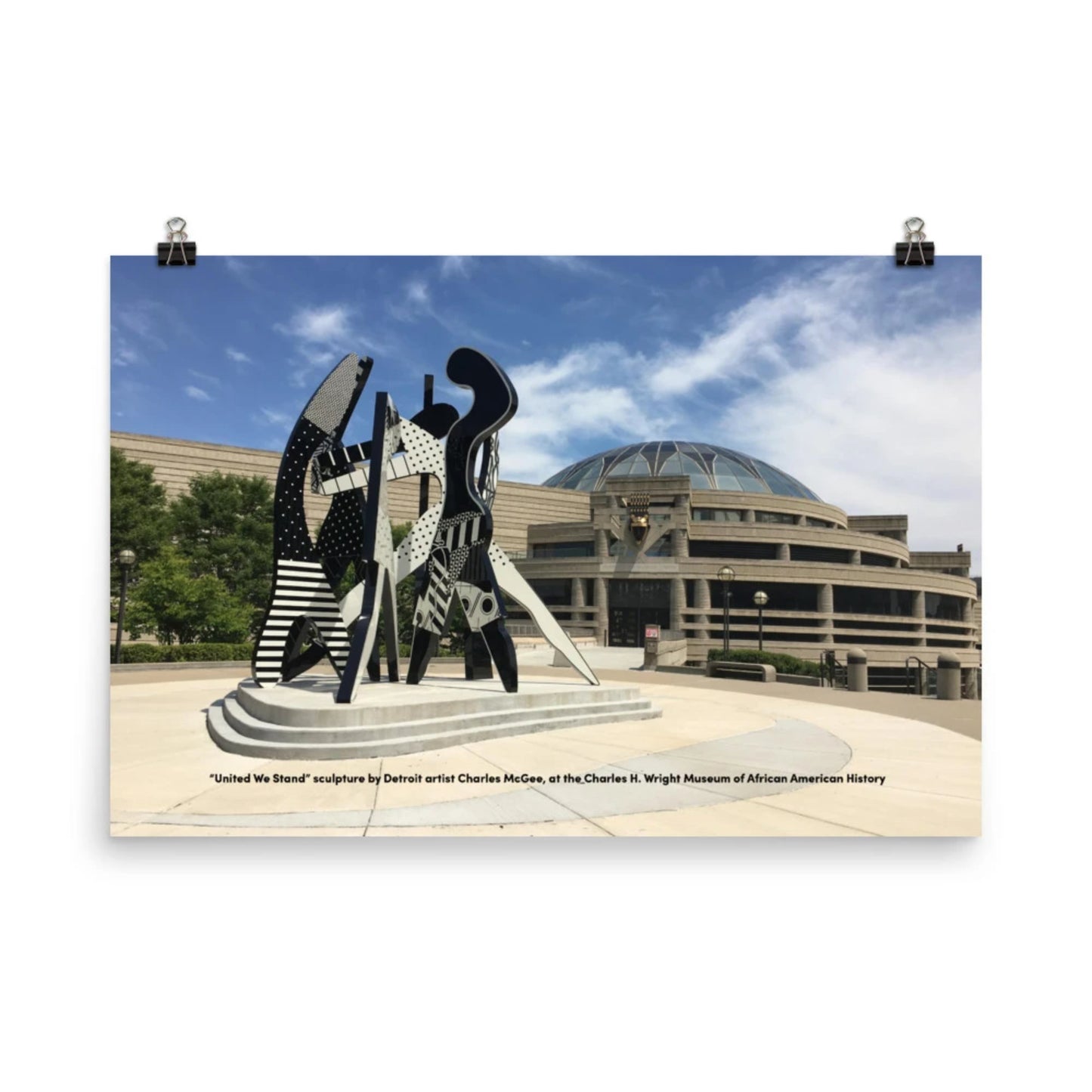 rectangular poster with United We Stand sculpture in front of Charles H. Wright Museum of African American History