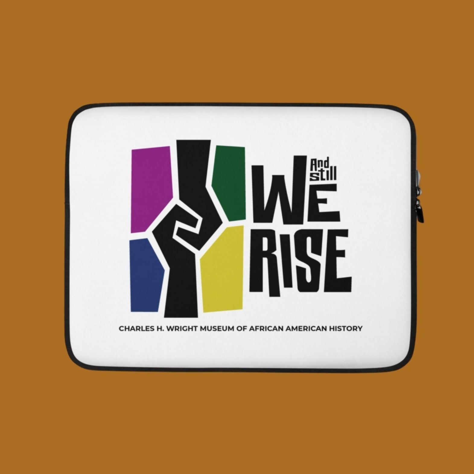 Computer laptop protective sleeve with the And Still We Rise exhibition logo on front