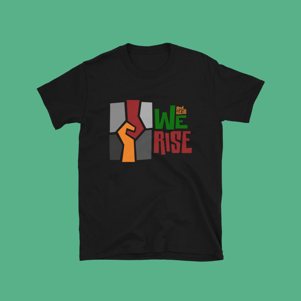 black cotton t-shirt with And Still We Rise exhibition logo