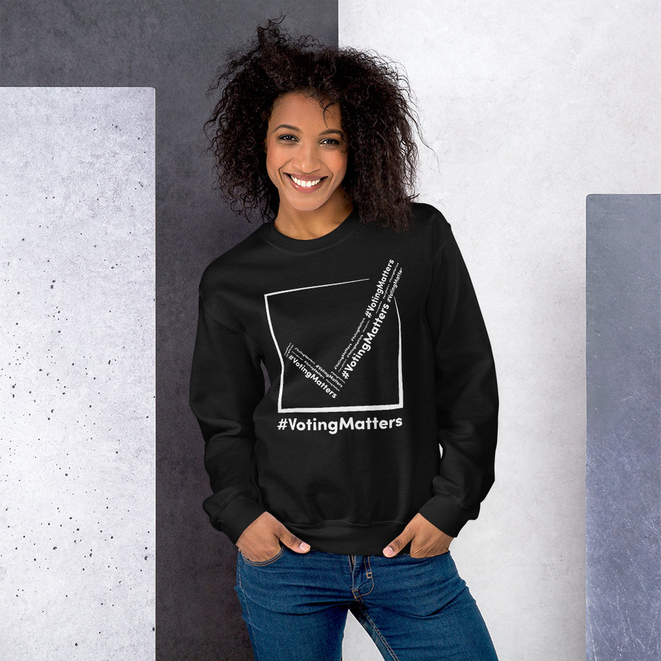 African American woman wearing black sweatshirt with white  hashtag voting matters logo on it
