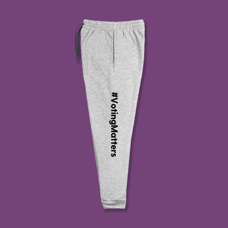 light grey cotton sweatpants with hashtag voting matters printed lengthwise in black on the left leg of pants